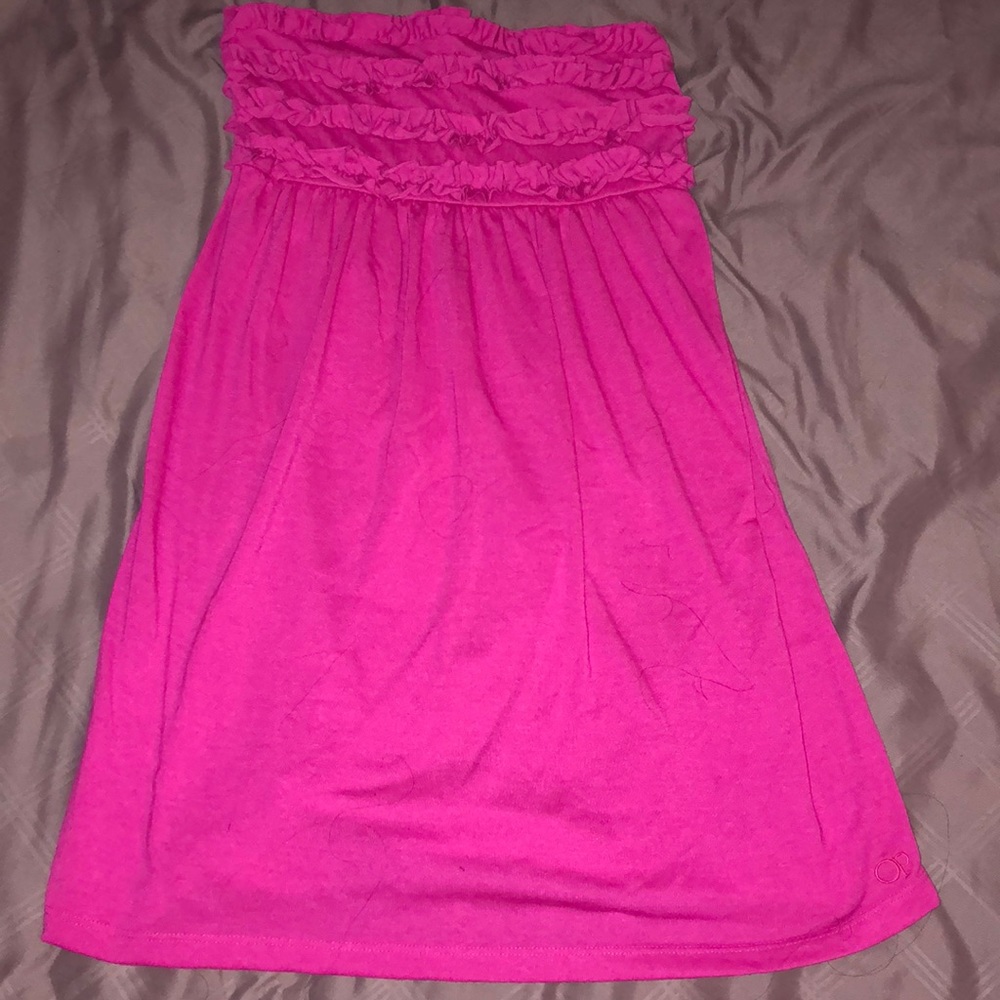 Pink bathing suit coverup.